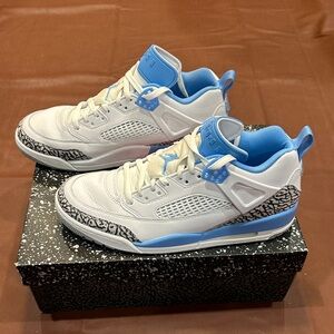 Jordan Men’s White and University Blue Retro Basketball Sneakers